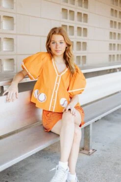 Queen Of Sparkles Orange Peplum Baseball Top